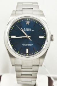 Unused Rolex Mens 39mm Stainless Steel Oyster Perpetual Model 114300 Oyster Band Stainless Steel Smooth Bezel Blue Index Dial